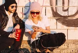 Two people walking outside